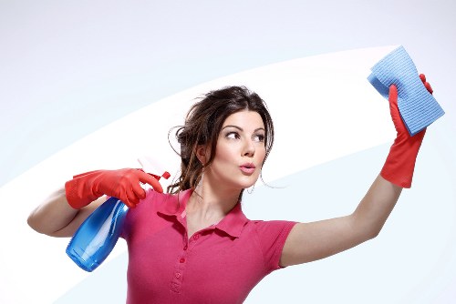 Carpet cleaning operative carrying equipment safely